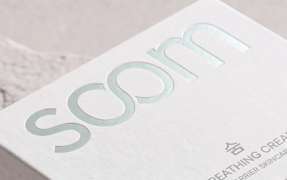 Mint-foil soom wordmark and 숨 Breathing Cream on the drawer box lid