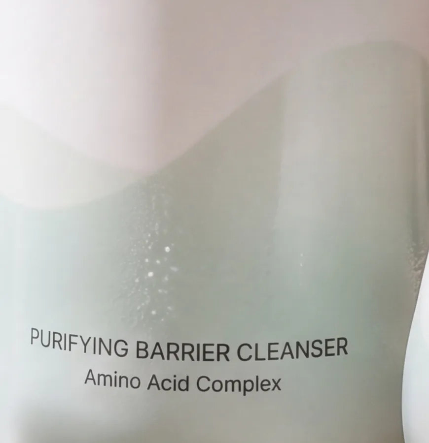 Close crop of the cleanser label: Purifying Barrier Cleanser, Amino Acid Complex